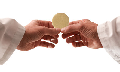 Hands of a priest consecrating a host with isolated background