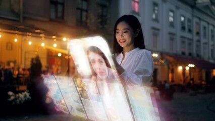 Wall Mural - Beautiful Asian woman using an augmented reality phone to communicates via videocall, browse web pages, apps, and social networks. Wireless communication concept. global digital network
