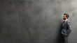 © Denis Yevtekhov - A well-dressed man in a business suit leaning confidently against a modern concrete wall, contemplating future plans, wide banner with copy space area Generative AI