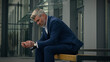 © Yuliia - Sad upset worried employer pondering thoughtful leader unemployment frustrated stress pensive senior business man sorrowful think relax old mature businessman problem solution thinking tired in city
