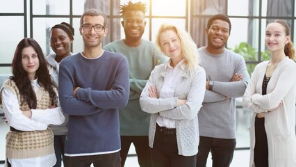 Wall Mural - Group of business people standing at the window of a modern office