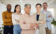 Business people, serious and arms crossed portrait in a office with diversity and senior woman ceo. Company, management team and confidence of professional leadership and creative agency group