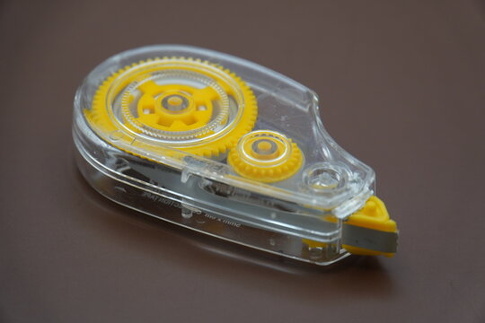 correction tape on brown background