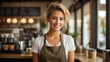 © anandart - beautiful blonde woman in apron against the background of a food hall, bar or restaurant