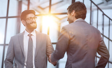 Wall Mural - Business people shaking hands, finishing up a meeting