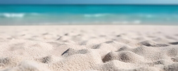 White sandy beach on background of turquoise ocean and blue sky