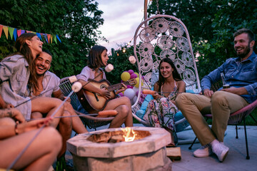 Canvas Print - Group of friends having party by swimming pool