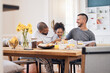 © Wesley/peopleimages.com - Laugh, gay men and family at breakfast together in the dining room of their modern house. Smile, happy and girl child bonding and eating a healthy meal for lunch or brunch with her lgbtq dads at home