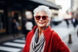 © ADDICTIVE STOCK - Generative AI image of portrait of smiling elderly female with gray hair sunglasses looking at camera while standing on street blurred background