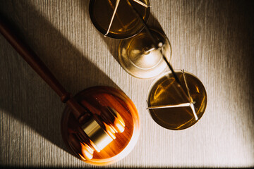 Business and lawyers discussing contract papers with brass scale on desk in office. Law, legal services, advice, justice and law concept picture with film grain effect