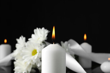 Wall Mural - Burning candle in darkness, closeup with space for text. Funeral symbol