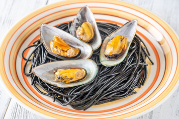 Canvas Print - Black pasta with mussels