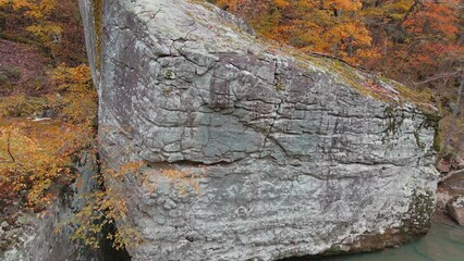 Wall Mural - Large boulder pull away revealing beautiful Arkansas ozark mountain yellow forest with autumn colored leaves