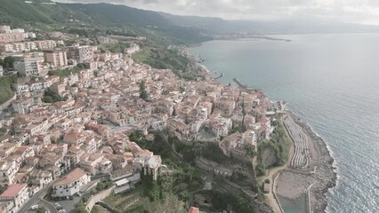 Canvas Print - Drone shot over Pizzo Beach with old shoreline houses under cloudy sky