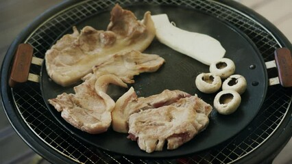 Poster - Closeup of meat steaks and stuffed mushrooms on metal grill