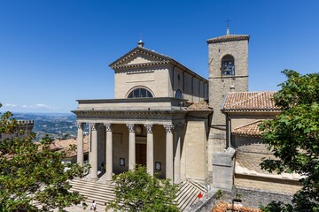 Sticker - Aerial view of the Basilica of San Marino church situated among a picturesque landscape of mountains