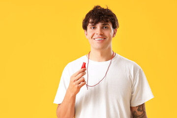 Sticker - Male lifeguard with whistle on yellow background