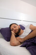 © Branislava Živić/Stocksy - Close-up of a young bearded male model sleeping in the morning