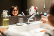 © Valentina Barreto/Stocksy - kid brushing teeth in the bathroom