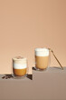 © Marc Tran/Stocksy - Various coffee drinks on brown background