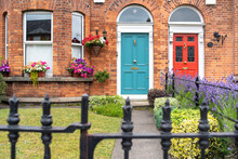 Irish Neighborhood With Colorful Doors And Garden 