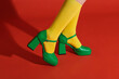 © Marc Tran/Stocksy - picture of woman feet wearing colored socks in high heels shoes