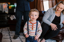 Portrait Of A Toddler Boy Standing In Living Room