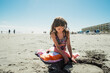 © Maria Manco/Stocksy - portrait of tween girl on beach