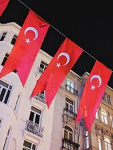 The Turkish Flag Flies Over Buildings 