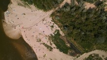 Many People Sunbathing On Sandy Beach And Swimming In Vistula River Close To The Anna Jagiellon Bridge, Warsaw. A Small Amount Of Water In The River. Water Shortage. Unguarded Beach. 4K 59.94 Fps