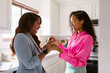 © ByLorena/Stocksy - Excited women office friends morning cheering
