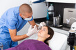 © JackF - Young woman getting procedure of injection contouring for facial correction in aesthetic cosmetology clinic