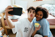 © BONNINSTUDIO/Stocksy - Teen friends spending time together at home