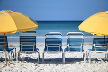 Yellow Beach Umbrellas And Chairs On A Gulf Coast Beach