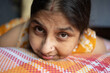 © Dream Lover/Stocksy - Candid expression of a middle aged Indian woman