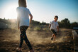 © Amanda Voelker/Stocksy - Children playing in the dirt