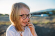 © Amanda Voelker/Stocksy - Close up portrait of young girl crying and laughing