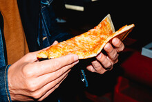 Man About To Eat A Slice Of Cheese Pizza