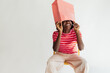 © Studio Firma/Stocksy - Woman with Bag on Her Head