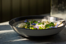 Spring Vegetable Salad With Pasta And Edible Flowers. 