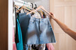 © Malquerida Studio/Stocksy - hanging clean clothes in the closet