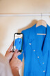 © Malquerida Studio/Stocksy - Photographing clothes with mobile phone