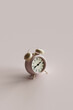 © Giada Canu/Stocksy - pink alarm clock with copy space