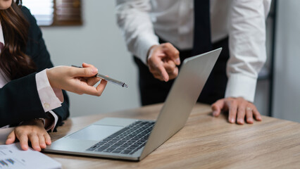 Canvas Print - Business executive reading financial data and brainstorming about new startup project together