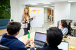 © Santi Nuñez/Stocksy - Manager woman during conference in office