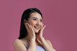 © Marc Tran/Stocksy - Beautiful Asian young woman touching soft cheek smile