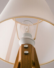 Outdated Incandescent Light Bulb In A Sleek Bedside Lamp 