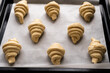 © Ivan Haidutski/Stocksy - Before and after -homemade croissant baking at home. Side view