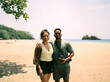 © Kristen Curette & Daemaine Hines/Stocksy - An African American couple on the beach posing