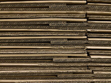 Stack Of Cardboard Boxes Background In Warehouse Shipping Facility